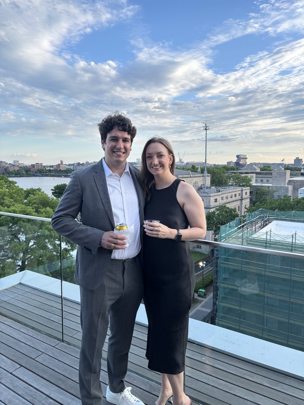 Michael and Alyssa dressed up together on a rooftop